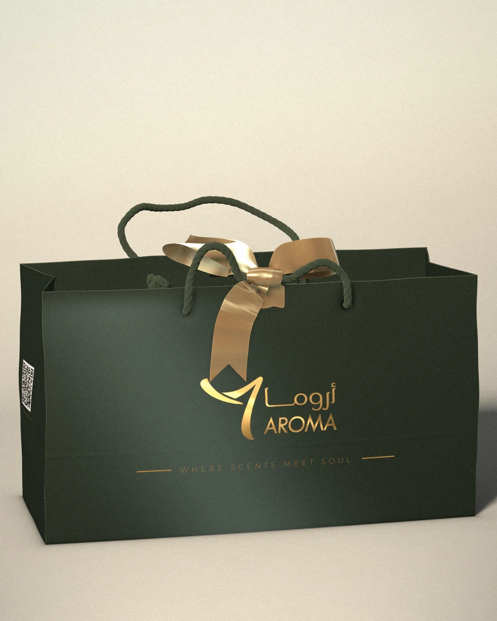 The deep green 7 AROMA gift bag, shown upright on a soft cream backdrop, with the gold-foil logo and tagline on the front, dark green rope handles and a gold satin bow tied at the top